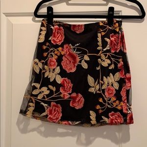 Black floral mini skirt